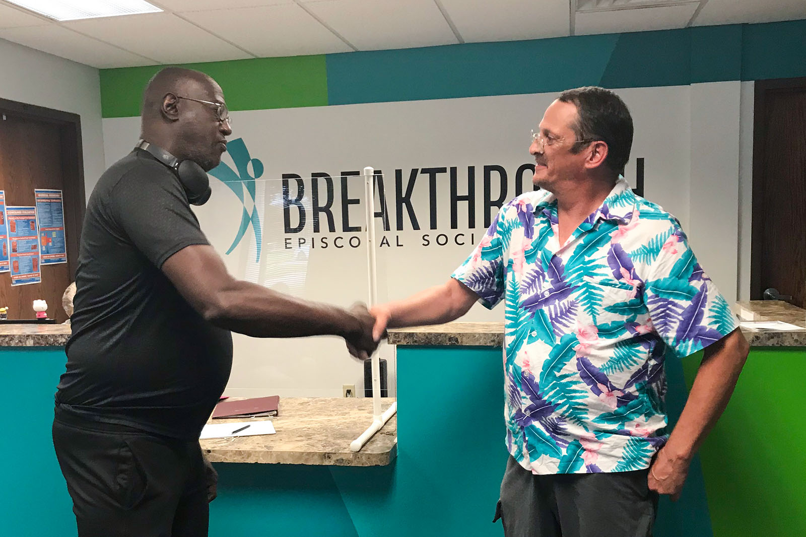 Breakthrough Clubhouse members shaking hands